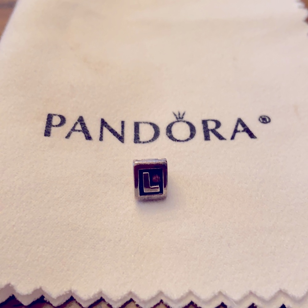 Pandora bracelet “L” charm
